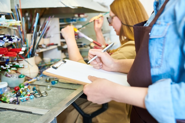 Female Artists Collaborating in Workshop