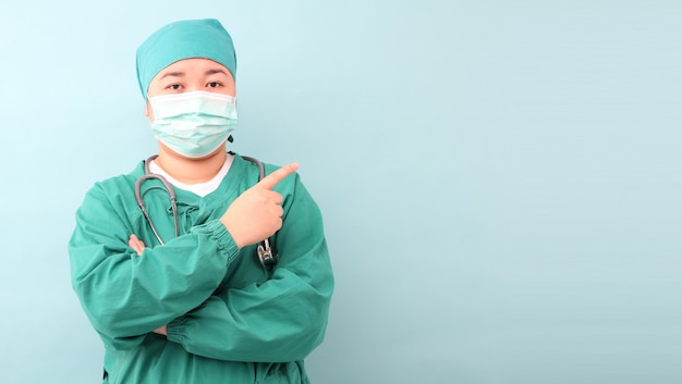 Female asia surgeon,surgeon showing stethoscope wearing surgeon mask