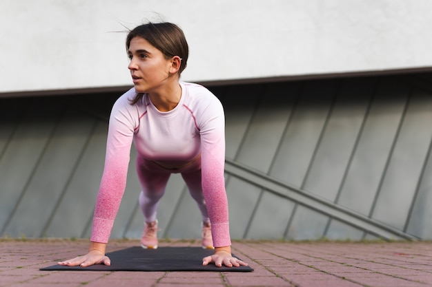 Female athlete shakes the press