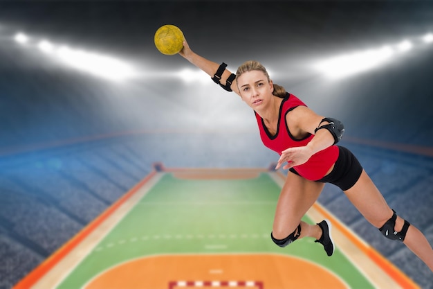 Female athlete throwing handball