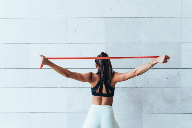 Female athlete with stretching bands.