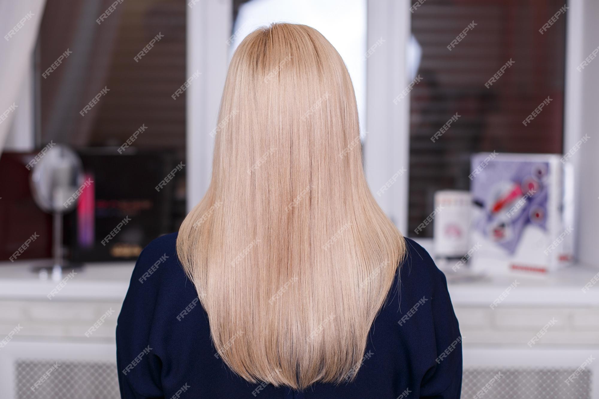 Premium Photo | Female back with long straight natural blonde hair in hairdressing salon Premium Photo | Female back with long straight natural blonde hair in hairdressing salon