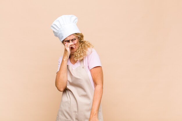 Female baker feeling disgusted