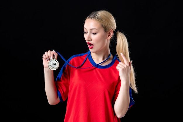 female basketball player with golden medal on black background athlete game winners trophy