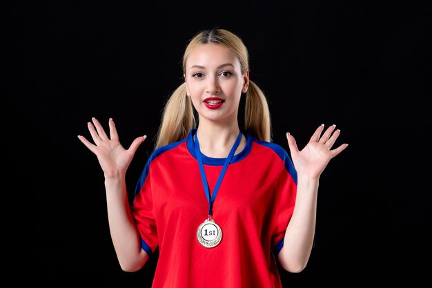 female basketball player with golden medal on black background athlete game winning trophy