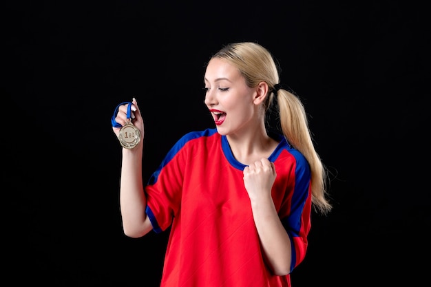 female basketball player with golden medal on a black background athlete trophy winner game