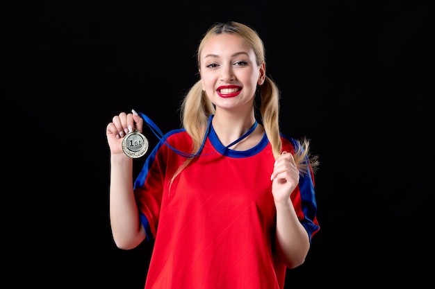 female basketball player with golden medal on black surface athlete game winner trophy