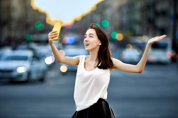 Female blogger makes video call from city street