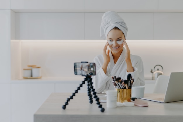 female blogger recording a skincare video tutorial