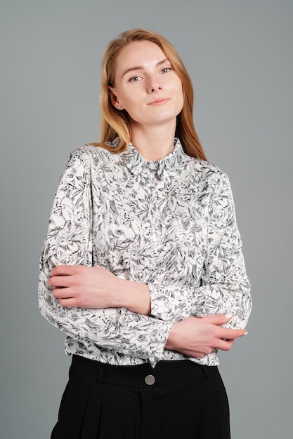 Female in a blouse and trousers Studio female portrait