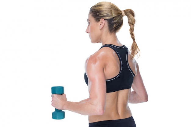 Female bodybuilder holding a blue dumbbell