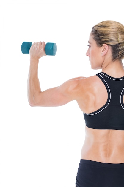 Female bodybuilder holding a blue dumbbell