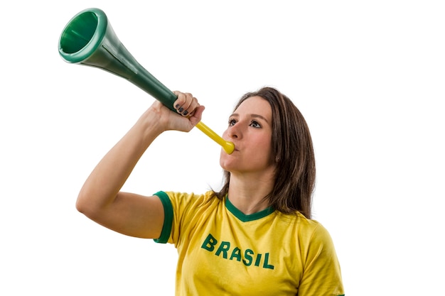 Female brazilian fan celebrating on a white space.