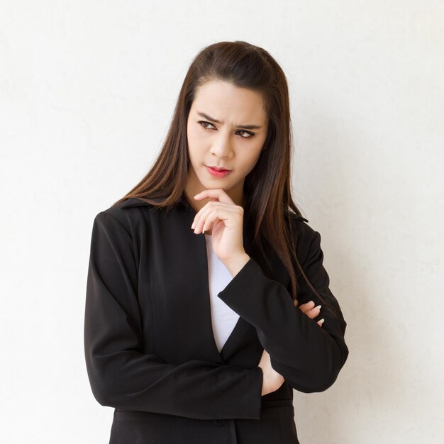 Female business executive thinking with stress or negative feeling