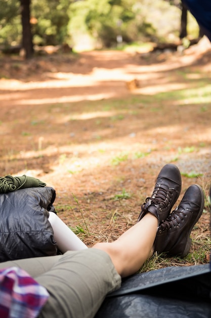 Female camper sitting in tent