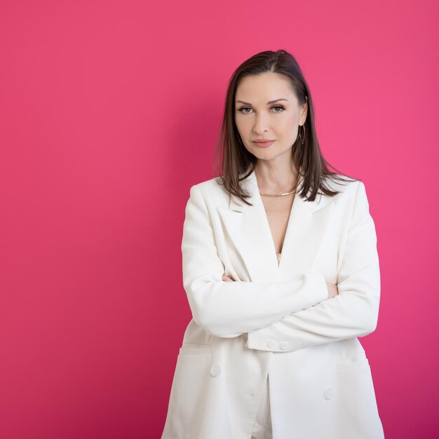 Female chief stylish and elegant modern business portrait on a bright background brunette in a white