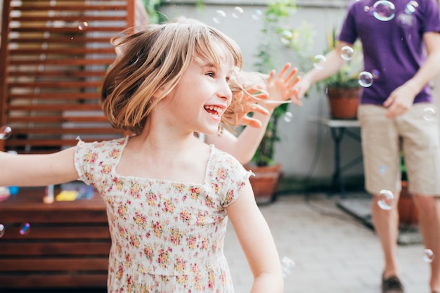 Female child playing with bubble soap