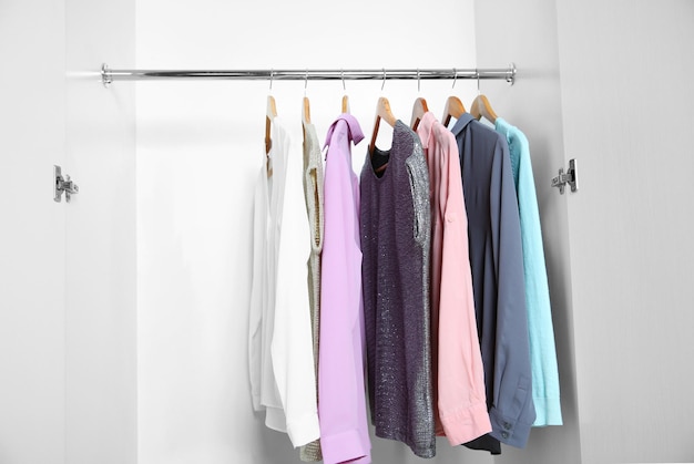 Female clothes hanging in wardrobe