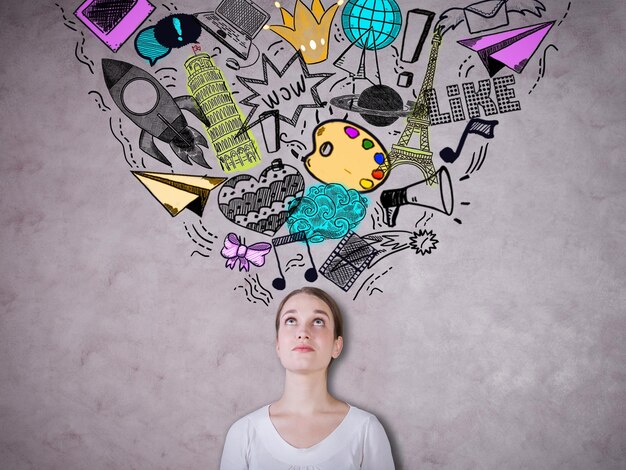 female on concrete background with drawings