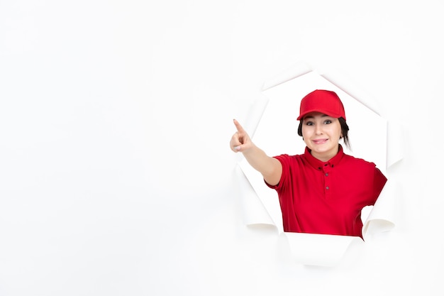 Female courier in red uniform on white