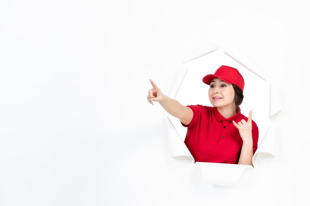 Female courier in red uniform on white