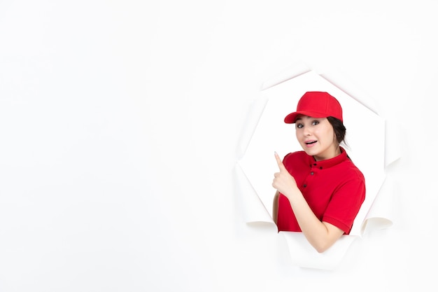 Female courier in red uniform on white