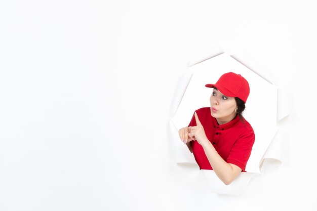 Female courier in red uniform on white