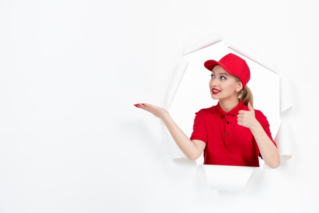 Female courier in red uniform on white