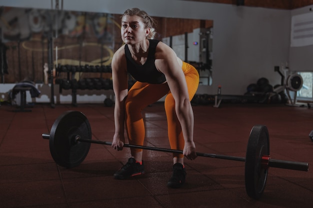 Female crossfit athlete working out