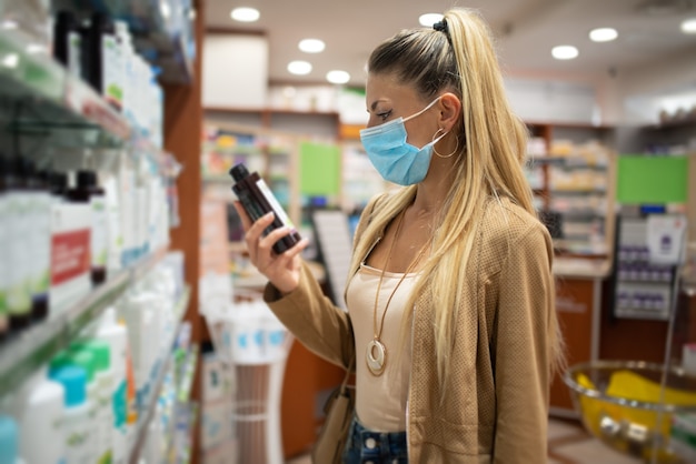 Female customer checking a drug or product in a pharmacy