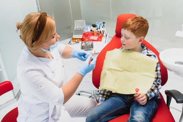 Female dentist and child in a dentist office