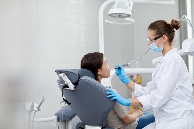 Female Dentist Working with Child