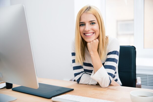 Female designer sitting at the table