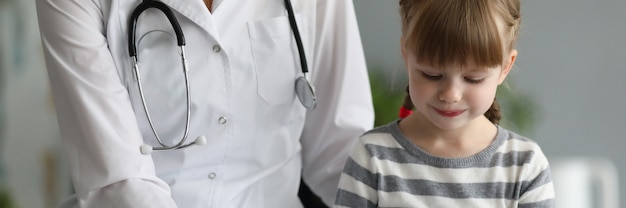 Female doctor exam child patient in hospital