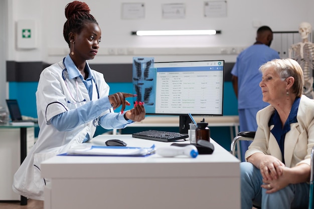 Female doctor examining chemical in laboratory