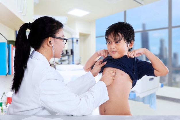 Female doctor examining a child patient