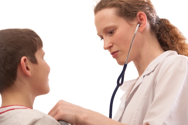 Female doctor examining child