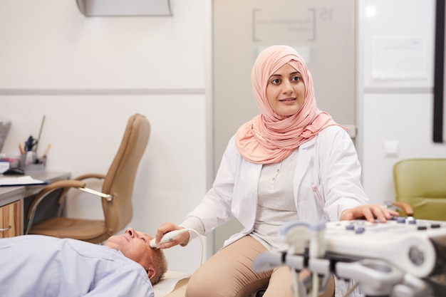 Female Doctor Examining Senior Patient