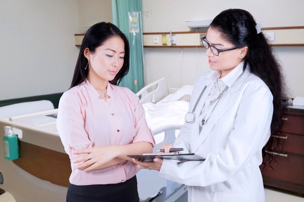 Female doctor explaining diagnosis to her patient