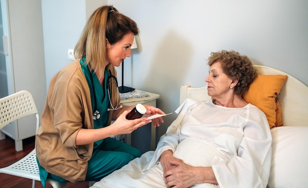 Female doctor explaining posology to a senior patient