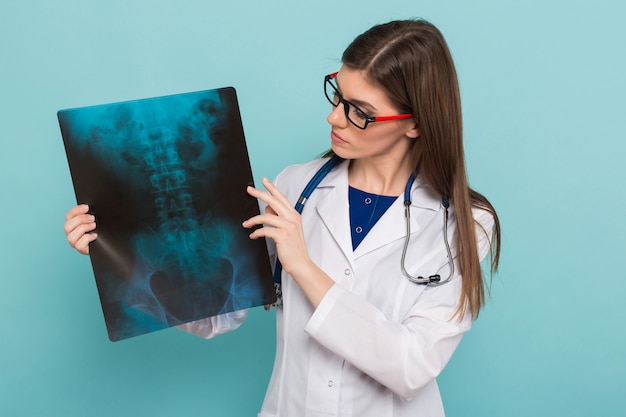 Female doctor in glasses with X-ray