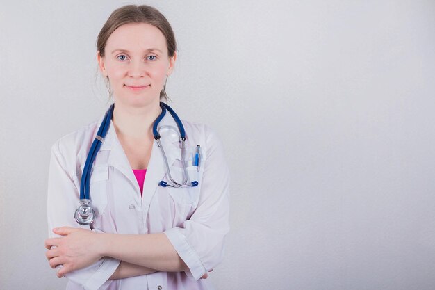 Female doctor on gray background