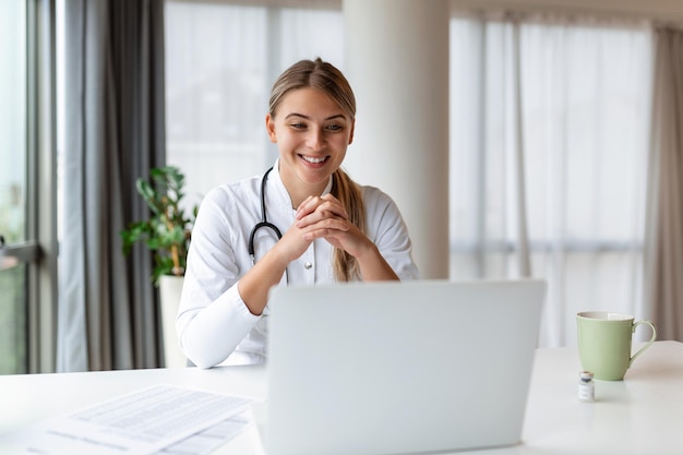 Female doctor having online therapy with her patient's giving them advice while using telemedicine as a new normal during COVID19 pandemic outbreak