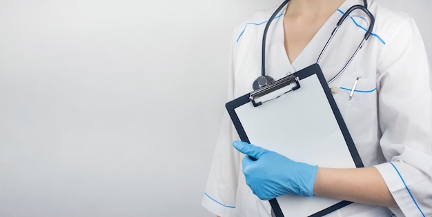 Female doctor holding a clipboard