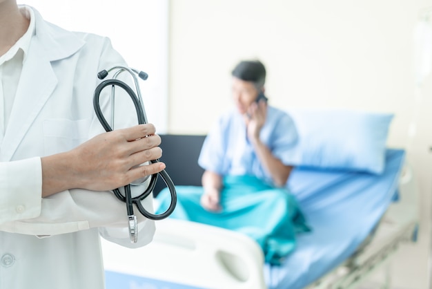 female doctor holding stethoscope