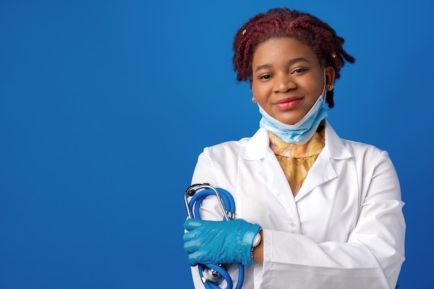 female doctor in lab coat with face mask