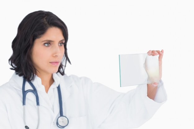 Female doctor looking at virtual screen