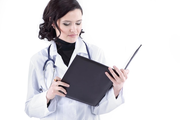 Female doctor making notes in the medical record