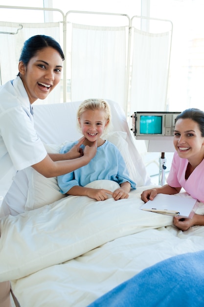 Female Doctor and nurse examining a patient