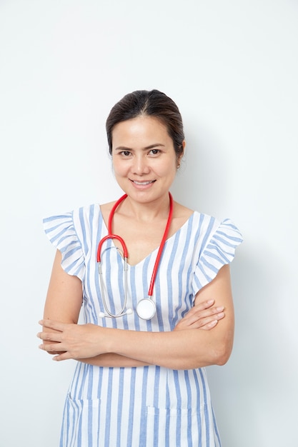 Female doctor nurse with red stethoscope